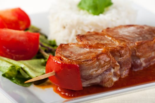 pork meat on skewers with rice