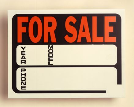 A black and white For Sale sign for vehicle sale
