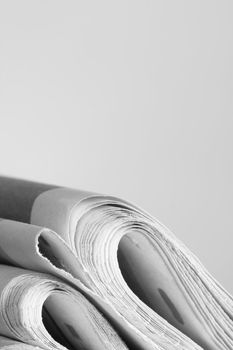 pile of news papers on white background