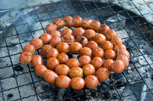 sausages in a grill