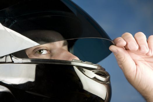 Close-up of a man wearing a motorcycle helmet