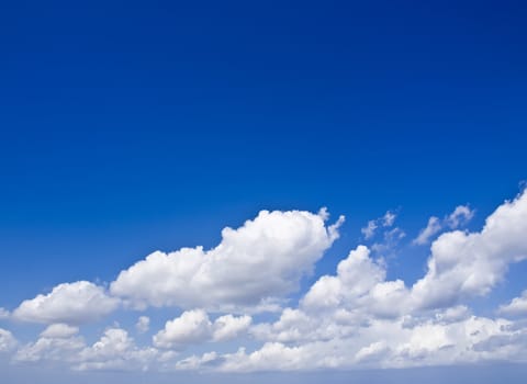 Clouds over a deep blue sky in the Mediterranean