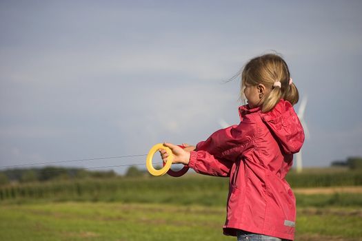 girl with kite in the open air