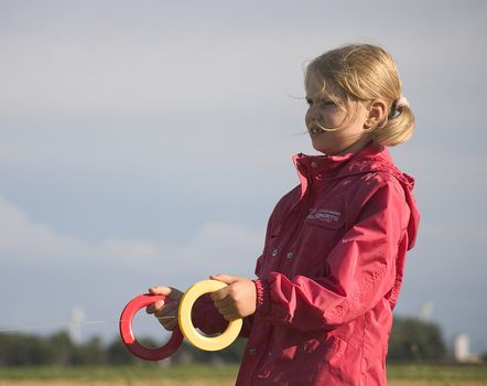 girl with kite in the open air