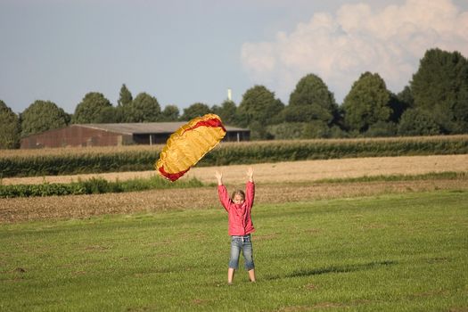 girl with kite in the open air