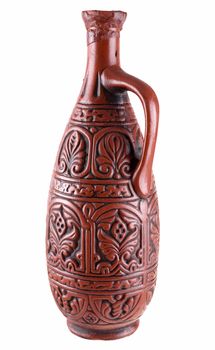 Dark brown clay jug on a white background