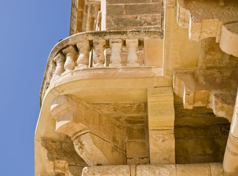 Detail of a medieval baroque stone balcony in Malta