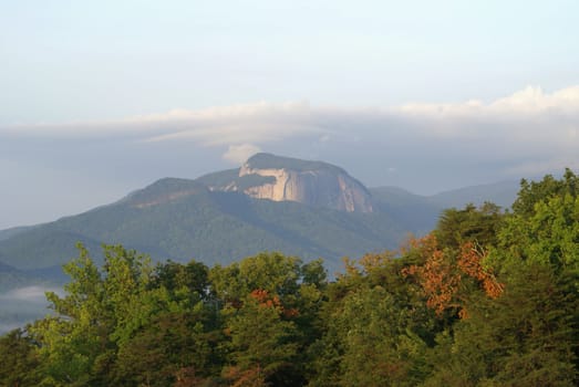 Big mountain scene at the start of fall.               