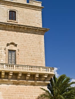 Selmun Castle in Malta was built by the Knights of the Order of St. John. Hooded figure in top window