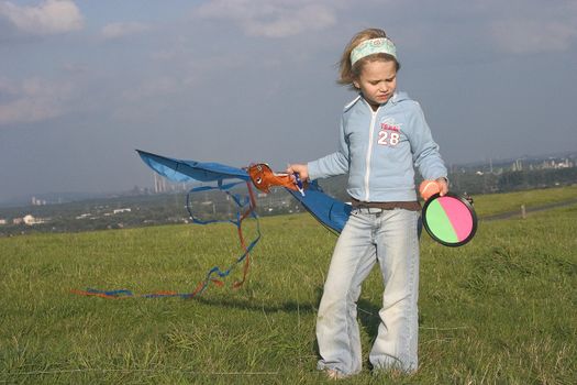 girl with kite in the open air
