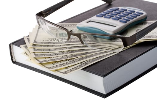 close-up business concept, money, notebook, glasses and calculator, isolated on white