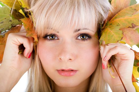 Close-up of young woman face with foliage