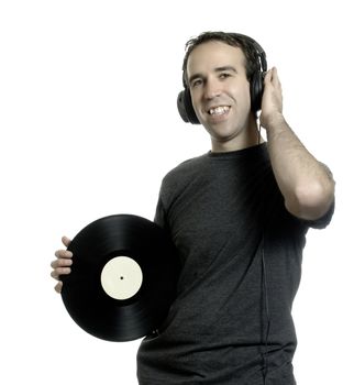 A man holding an old lp record and listening to music, isolated against a white background.