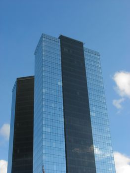 skyscraper blue sky and white clouds