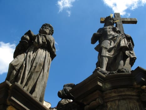 Skulpture of St. Jahn Nepomutsky on the Karlov bridge in Prague Czech