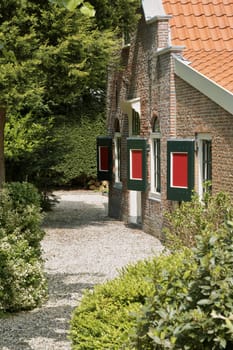 An old Dutch house in the summer sun in the area of Bloemendaal, the Netherlands