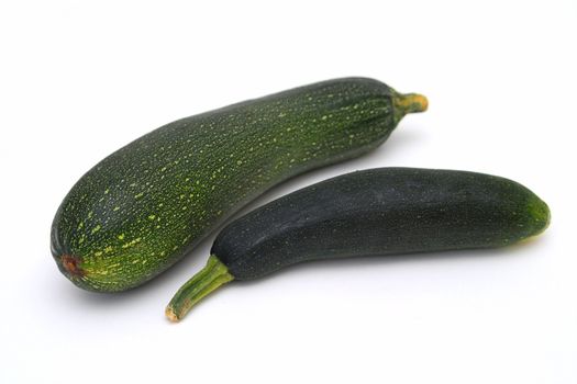 Two courgettes on the white background