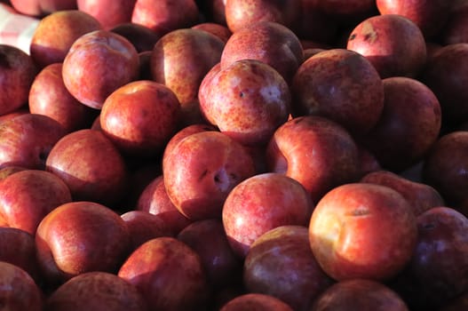 Organic red plums at the farmer's market