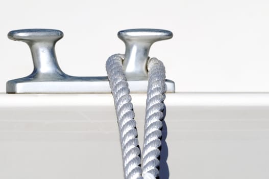 Detail of a rope securing a white boat