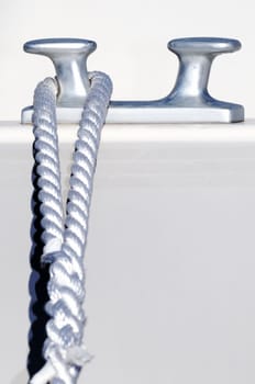 Detail of a rope securing a white boat