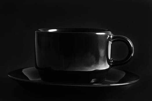 black cup over black background