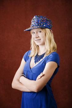 Teenage girl with braces wearing a hat with sequins