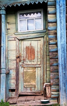 Entrance door on a facade of the ancient house