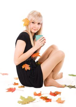 Young pretty girl warming up with a cup of tea