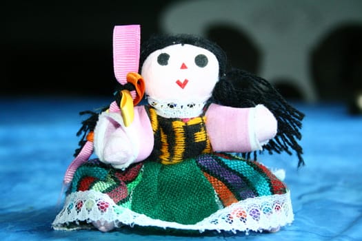 Small Mexican girl doll close up. 