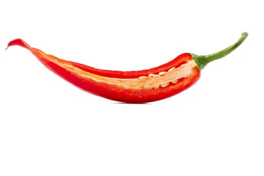 one cutted chili on white background