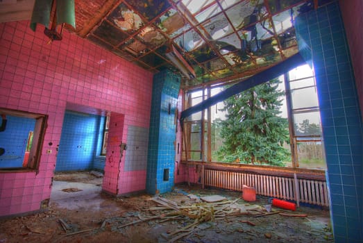 dirty tiled room in an abandoned building