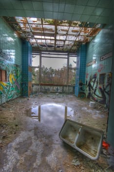 dirty tiled room in an abandoned building