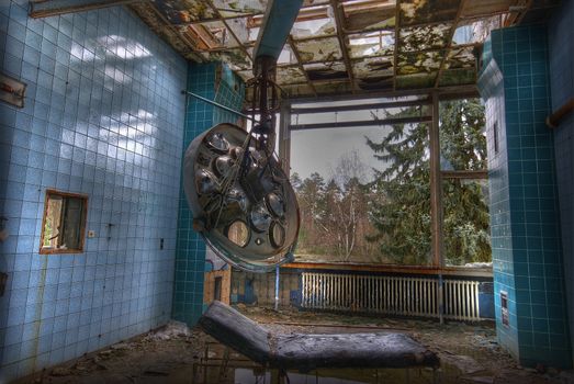 dirty operating room in an abandoned hospital