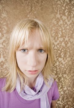 Cute young girl in purple showing annoyance