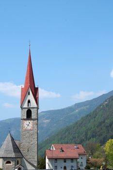 bell tower of a church in alpes