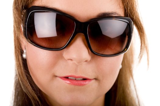 Close-up portrait of young woman's fase in sunglasses