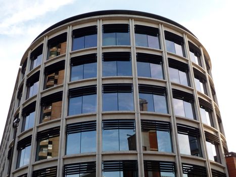 A modern office building that is curved.