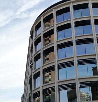 A modern office building that is curved.
