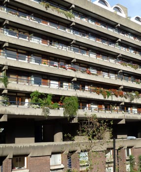 The side of a block of flats that are designed in the brutalist style.