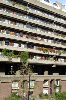 The side of a block of flats that are designed in the brutalist style.