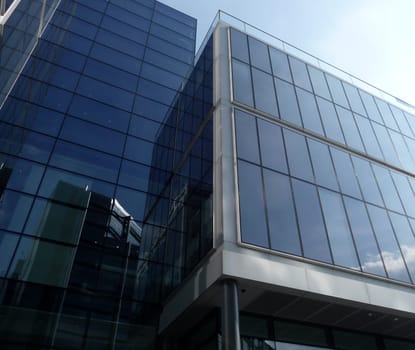 A modern glass building in central London.
