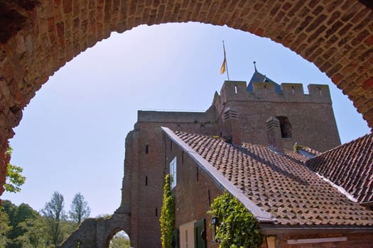 The remaining tower of the Ruins of Brederode seen from the archway. 