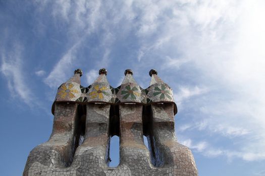 Chimney smoke stacks clustered together with tiles coving them