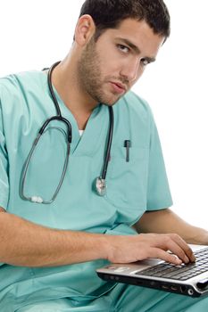 doctor with laptop and stethoscope on an isolated white background