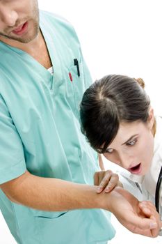 nurse checking pulse of patient on an isolated background