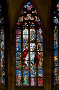 Detail of the color window - bullseye pane - "Holy Trinity".
Design: Max Svabinsky - 1930.
Public national monument - St Vitus cathedral, Prague, Czech republic, Europe.