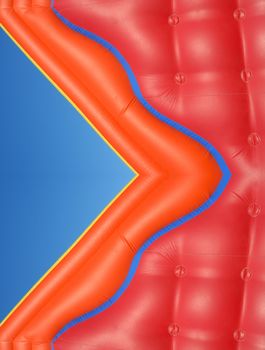 Partial view of a colorful inflatable blow-up toy on blue sky background 