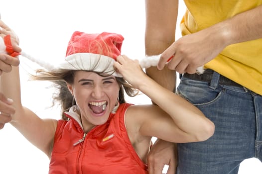 man pulling cap of woman with white background