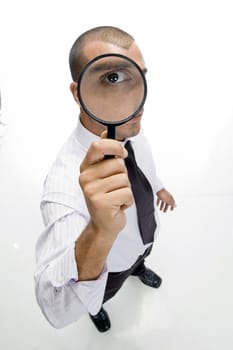 businessman looking through lens on an isolated background