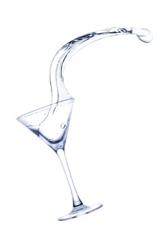 Freakish splashes transparent at its finest from a glass for martini close up.
